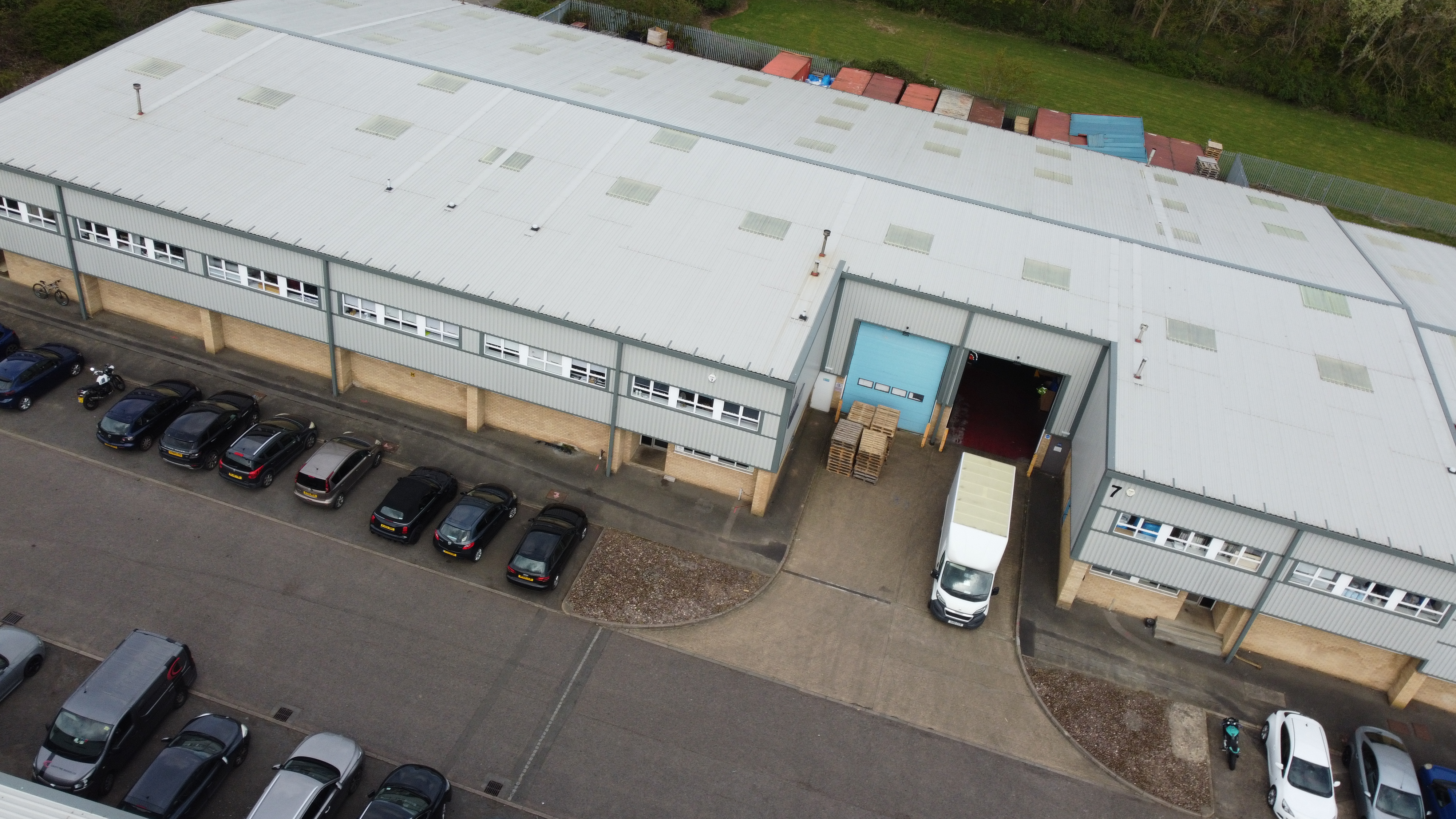 Existing industrial unit with offices, yard and parking available to lease.